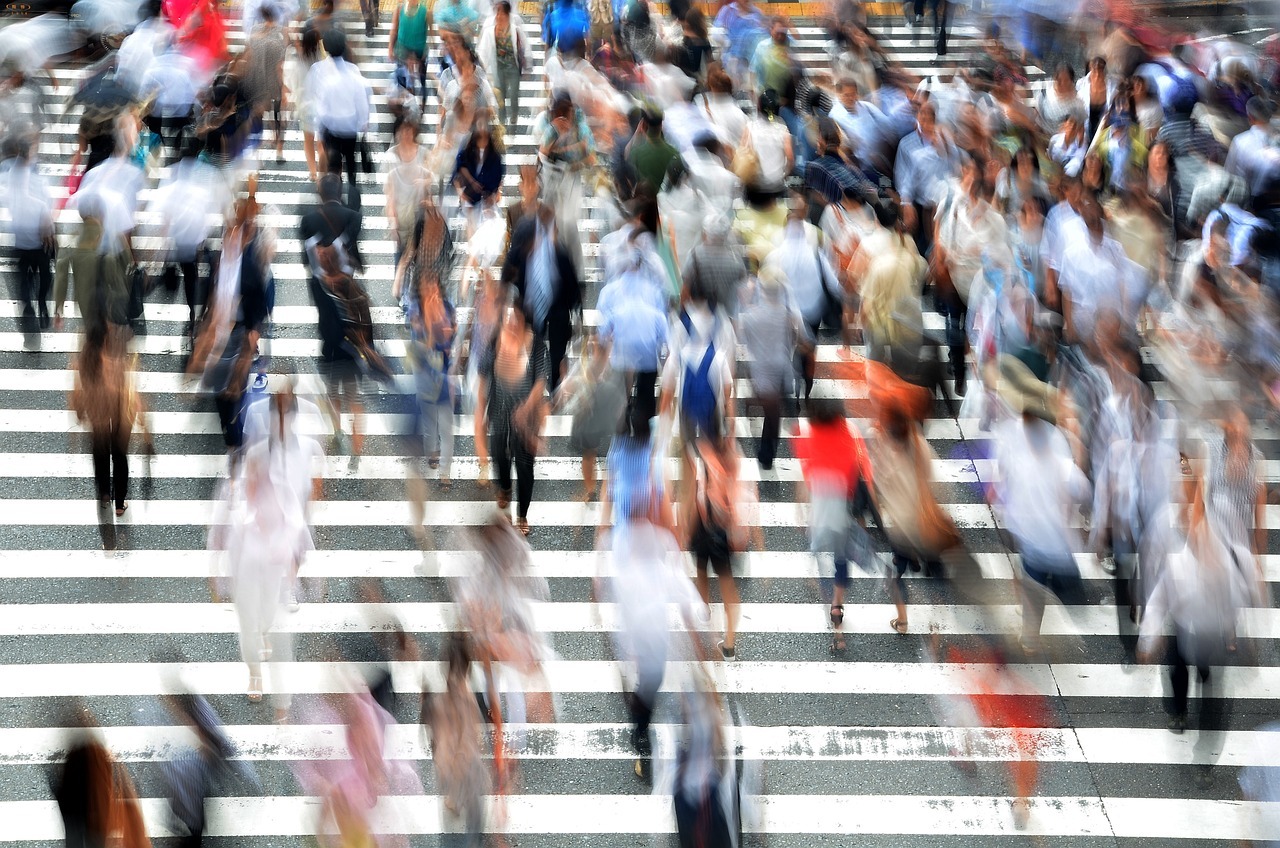 Blur image of people walking on a zebra crossing, rush hour, busy people