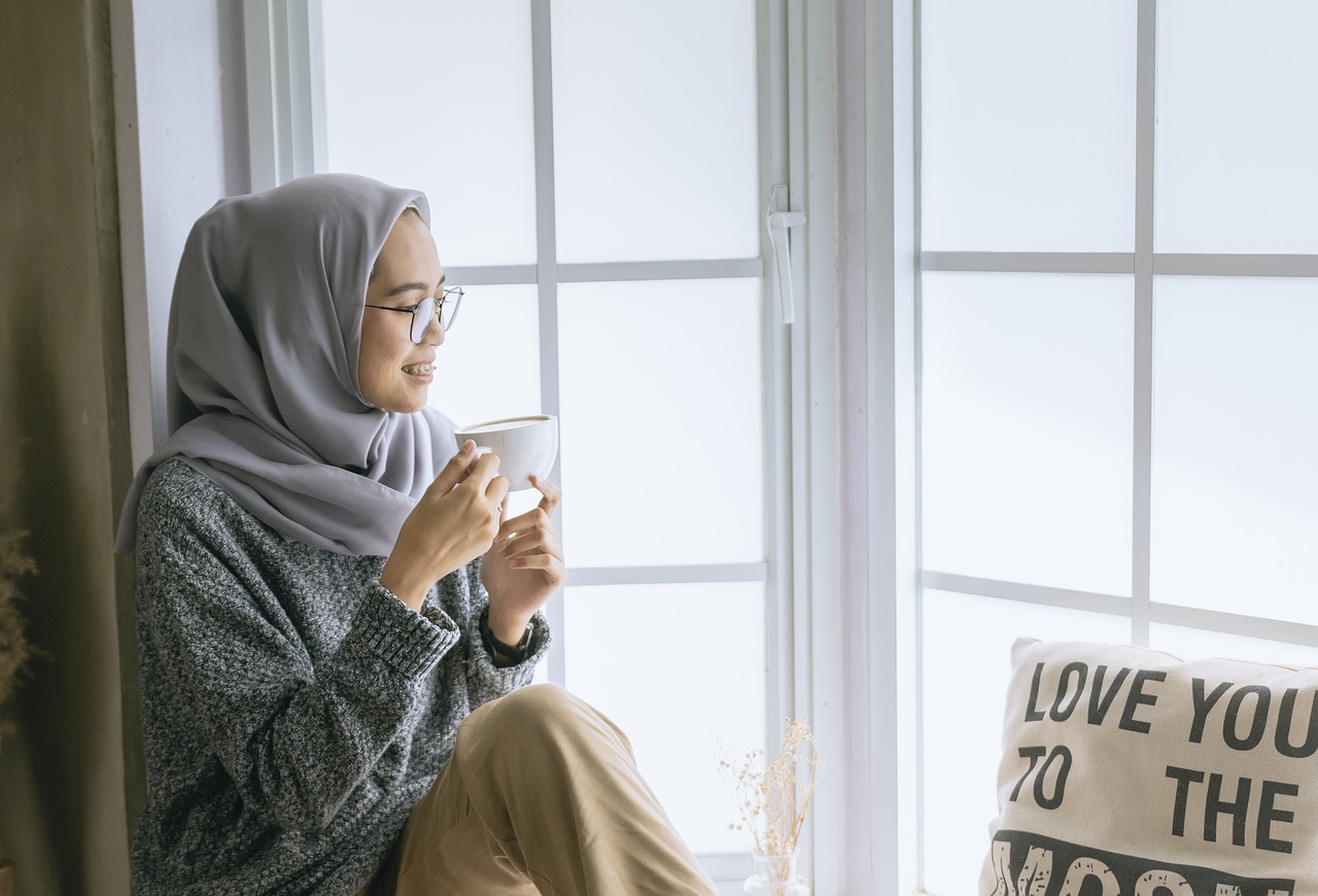 A women enjoying me time while having coffee or tea